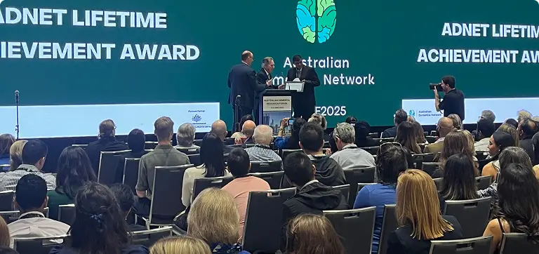 Audience watching presenters accept ADNET award at Australian Dementia Network event on diagnostics and alzheimers